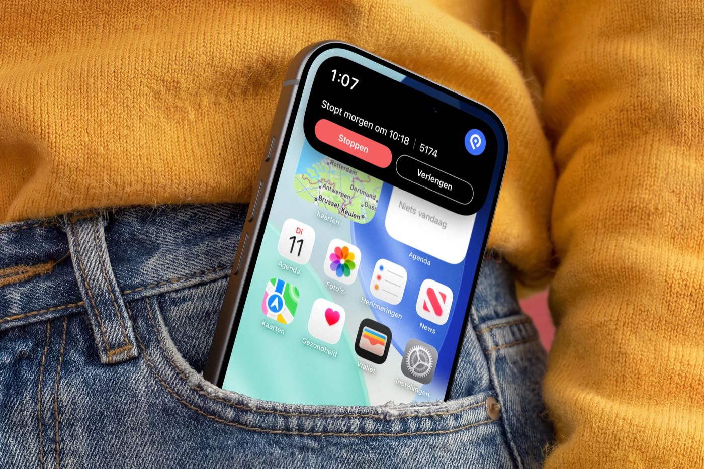 A phone in a jeans pocket with the SimplePark live activity on the screen