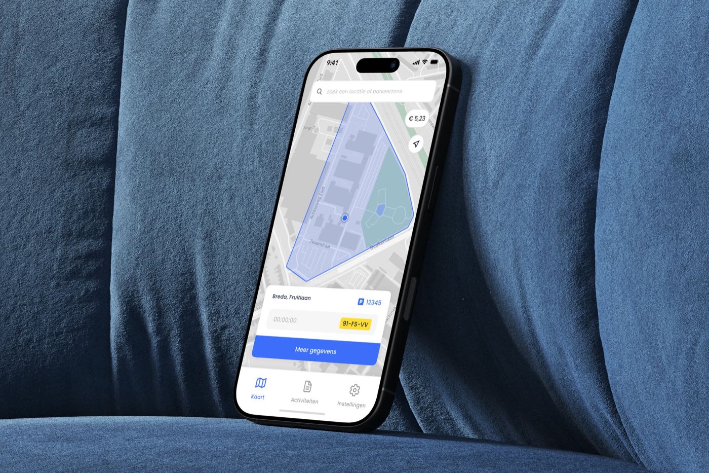 A phone on a sofa with the SimplePark map, the parking zone and the licence plate